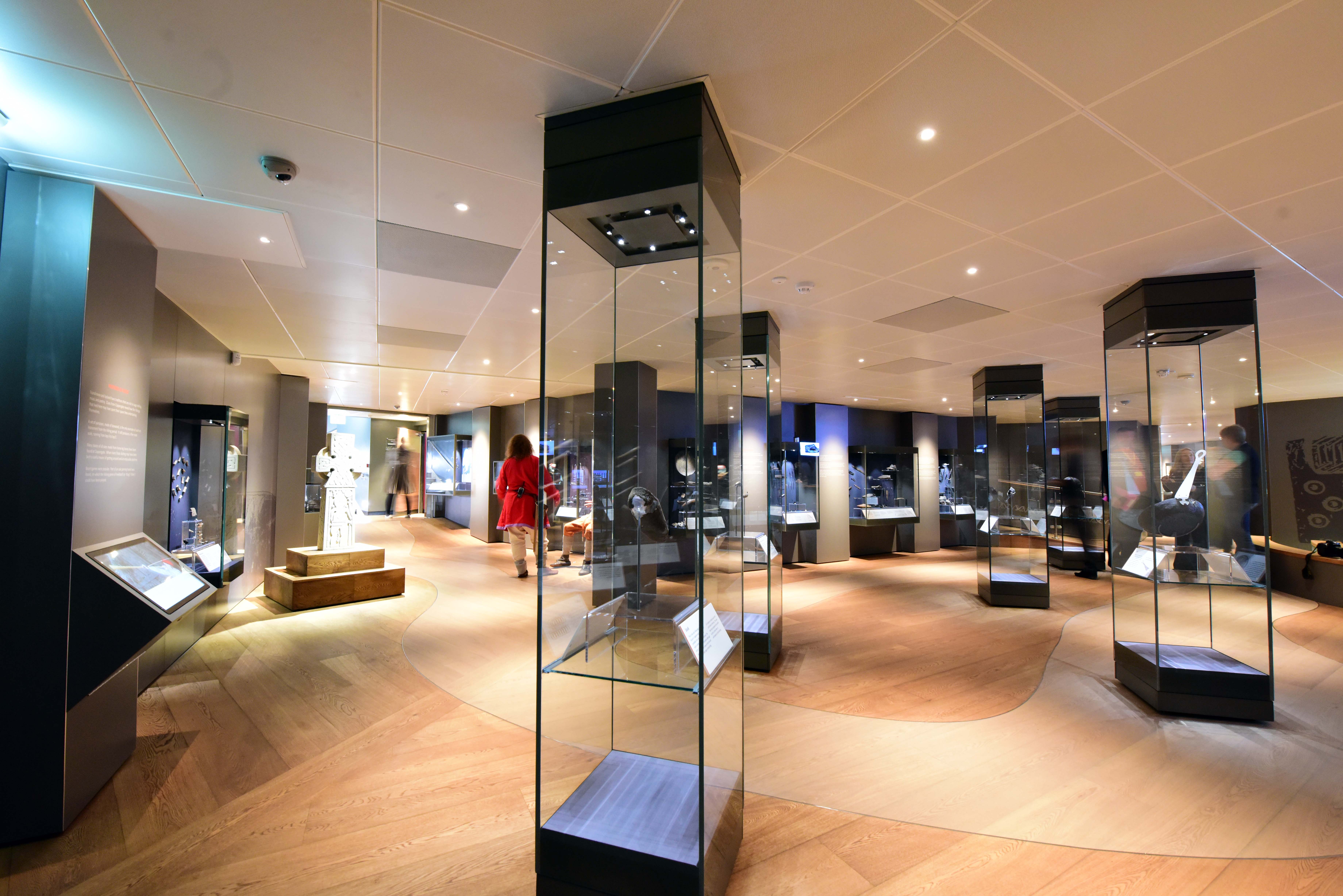 Select grade Oak flooring routed and oiled with various pigments to create meandering river in Viking Museum, York