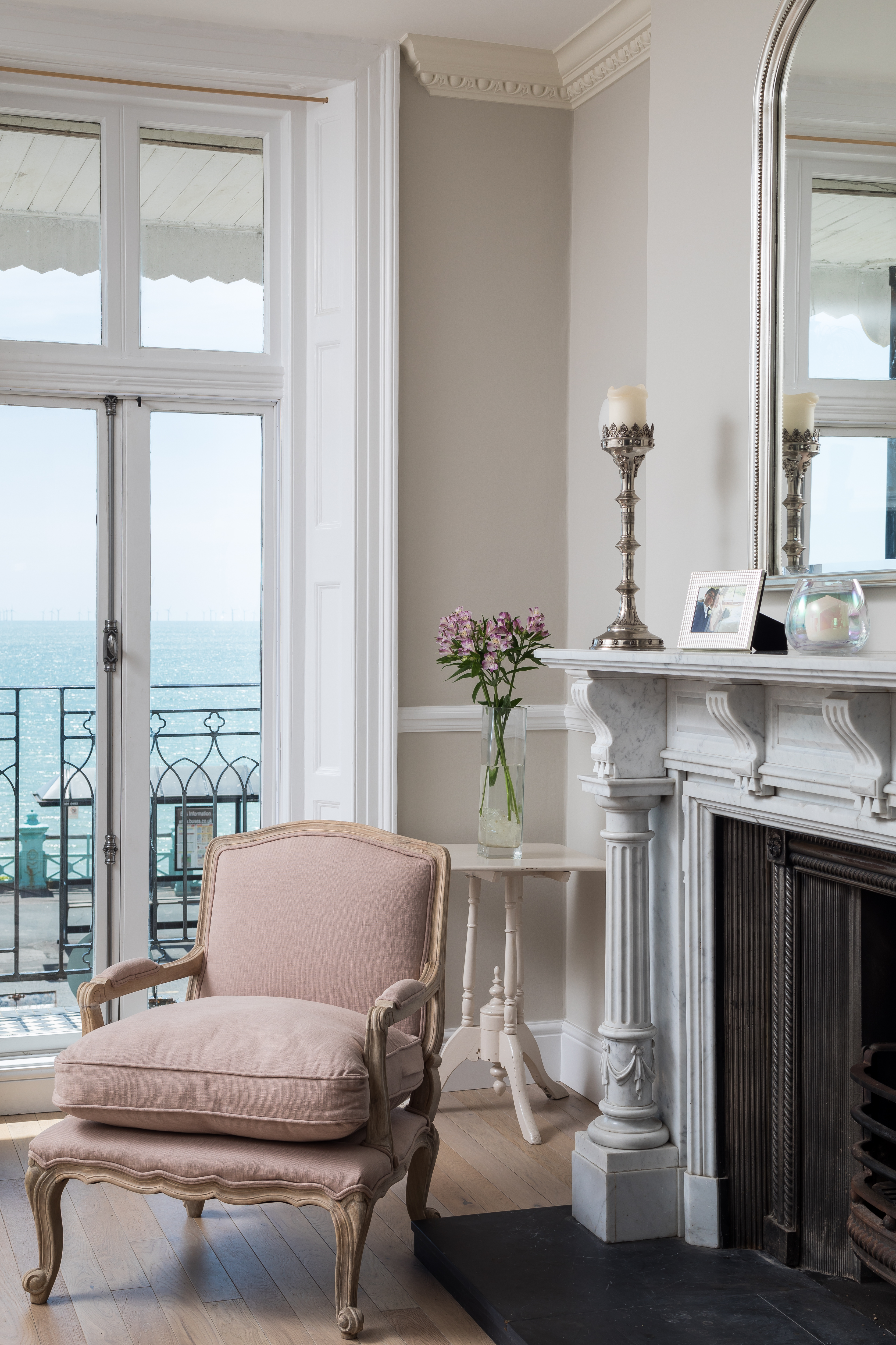 Pink armchair overlooking Brighton beach