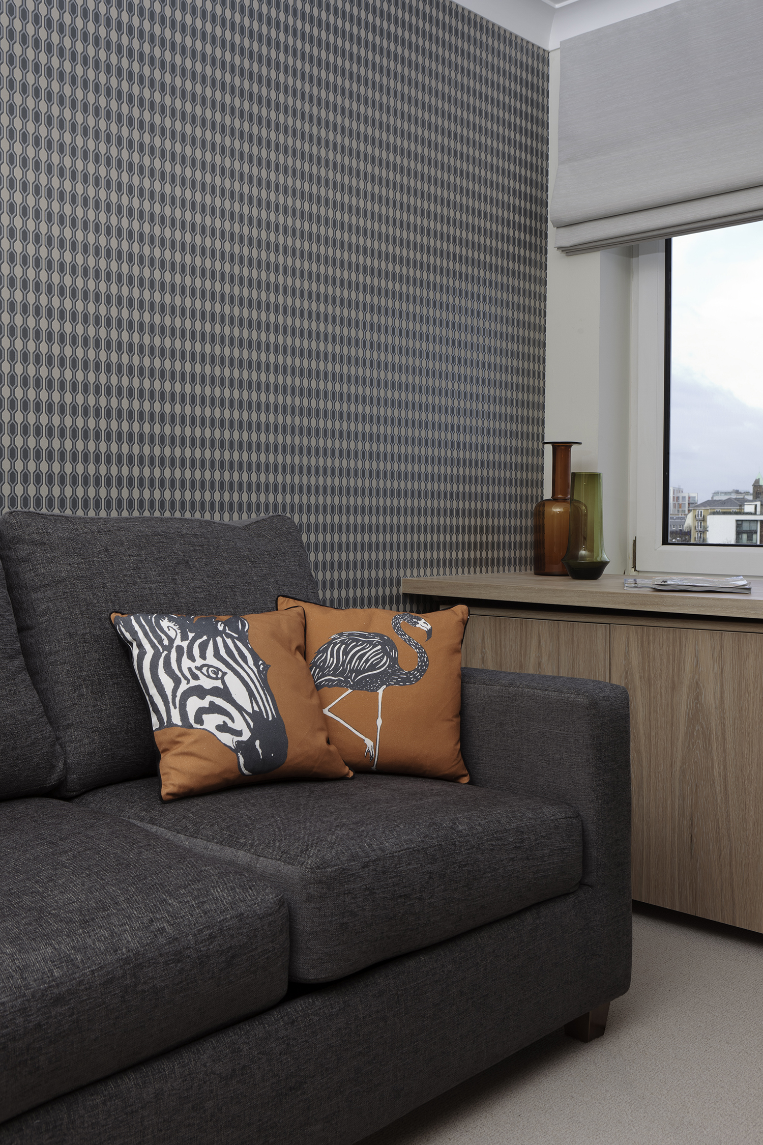 The study has bespoke limed oak fitted furniture. The sofa becomes a double bed for guests.