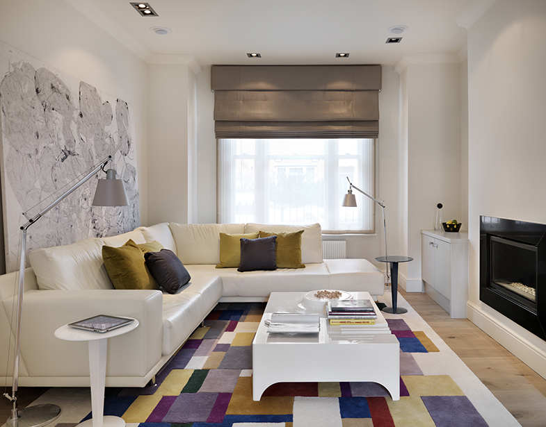 This living room scheme contrasts vibrant and youthful colours within a neutral and calming backdrop.