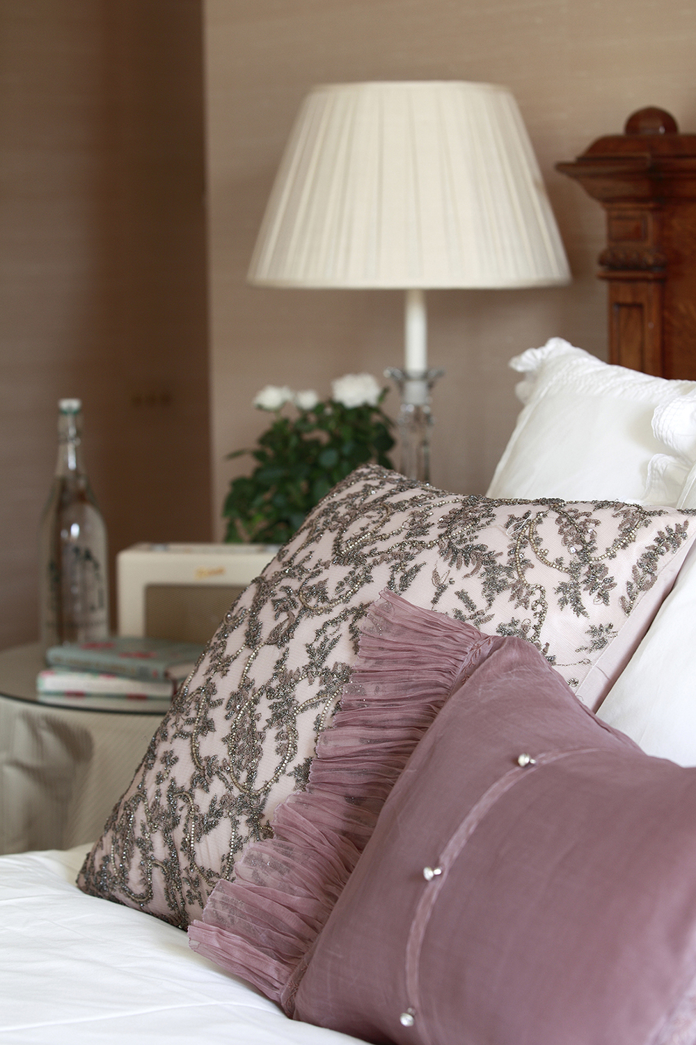 Silk beaded cushions adorn the bed and on the bedside table the ubiquitous Roberts Radio. 