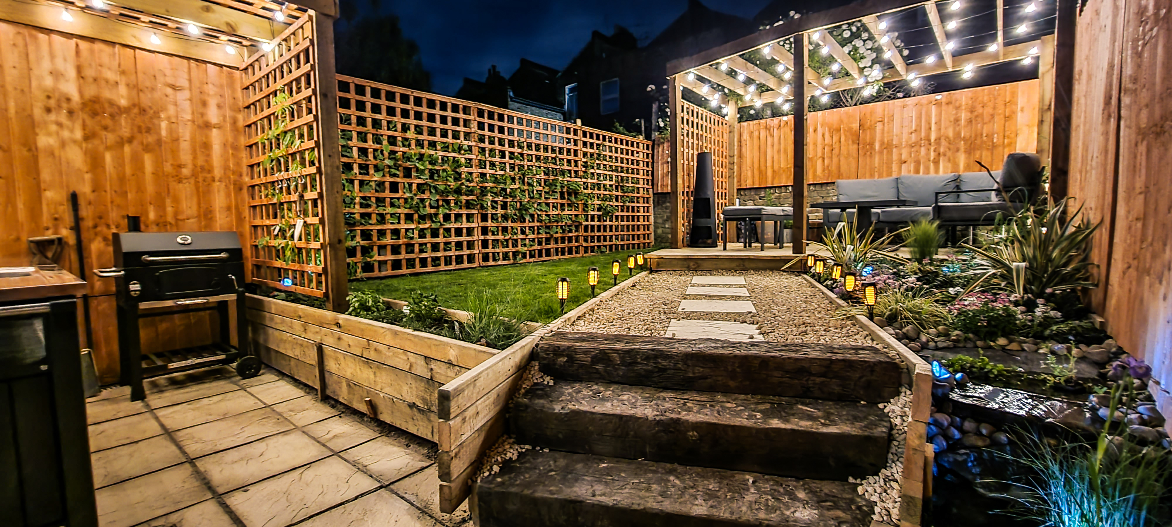 Landscaped Garden with Sitting Area, Outdoor Kitchen and Water Feature 