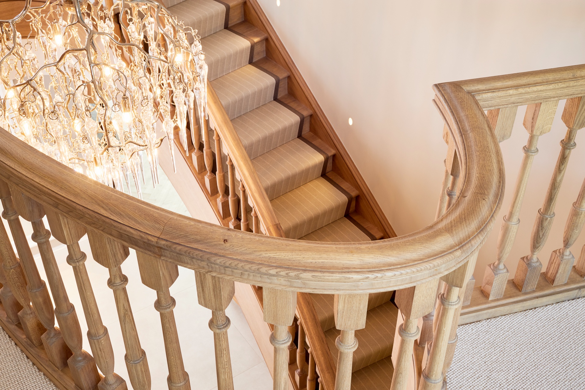 Detail view of the handrail and balustrade from an oak elliptical staircase