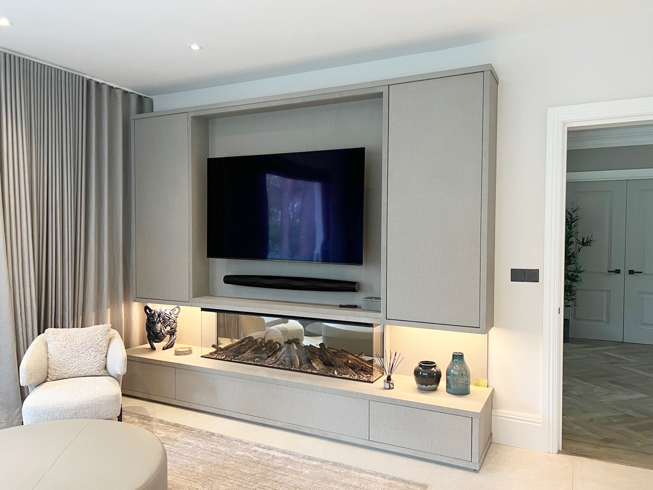 lounge bespoke media unit with integrated fireplace