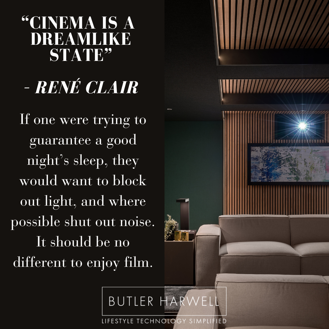 Photo of a Home Cinem, focussing on the projector light with the famous quotation : “Cinema is a  dreamlike state”   – René Clair