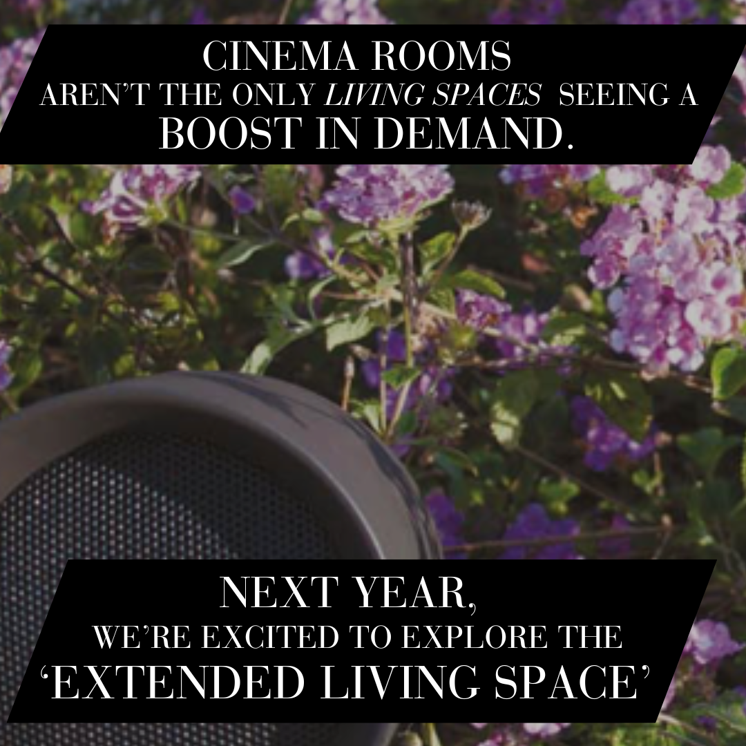 A photo of outdoor, weather resistant speakers in a flower bed. A caption reads:  "Cinema rooms aren't the only living spaces seeing a boost in. demand. Next year we're excited to explore the extended living space."