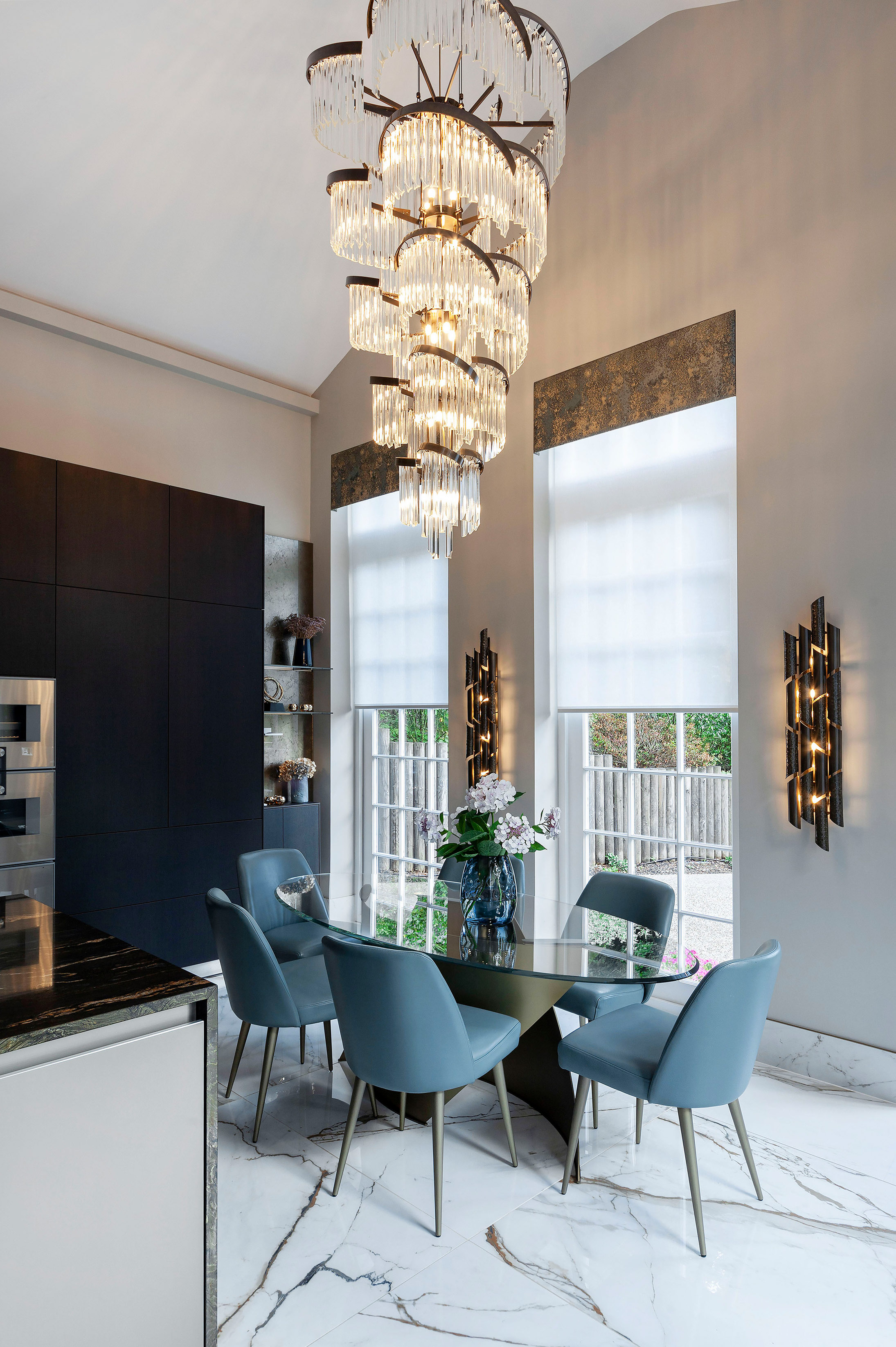 Feature double height chandelier above dining table