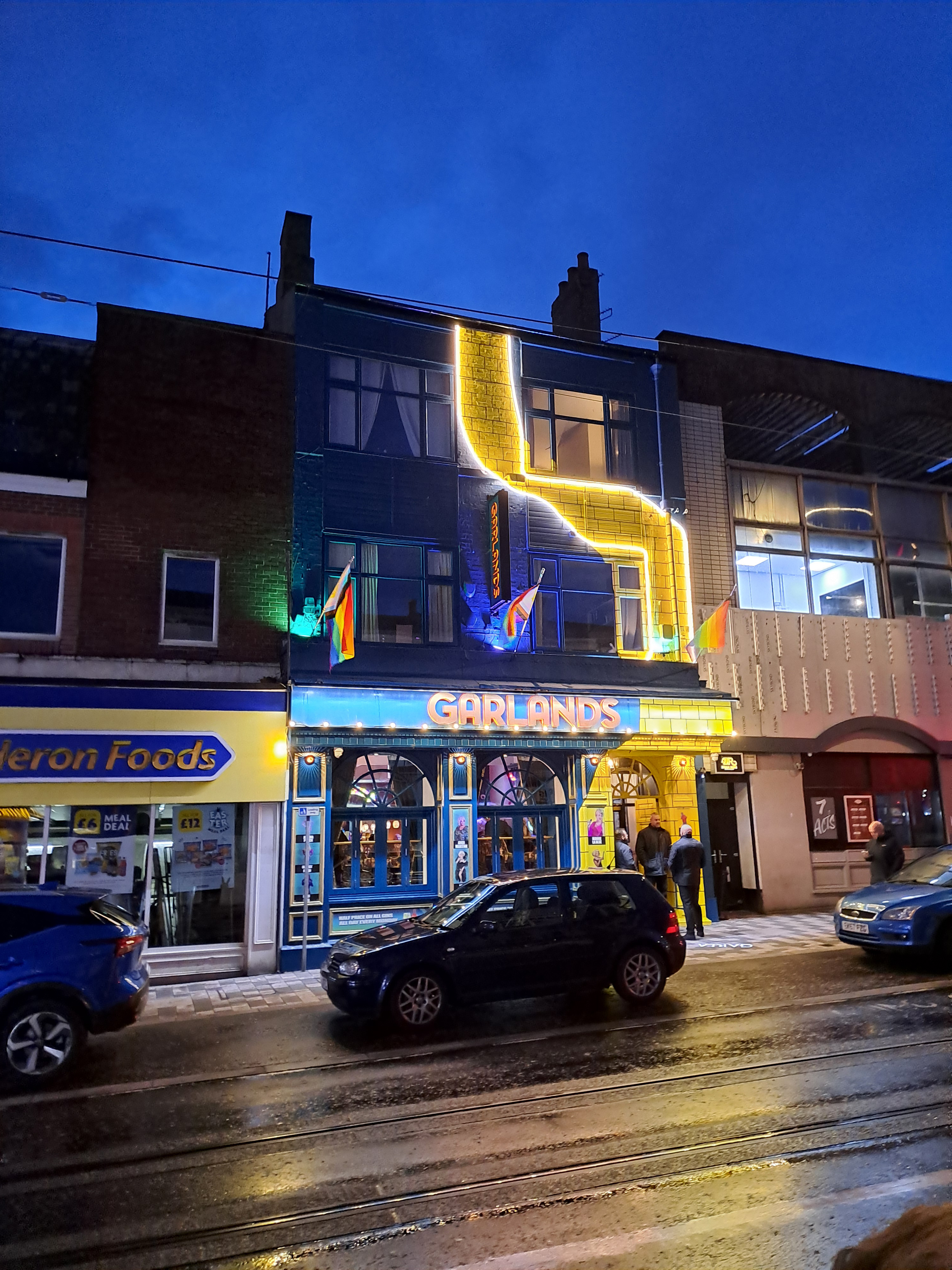 External facade shot with illuminated feature mural