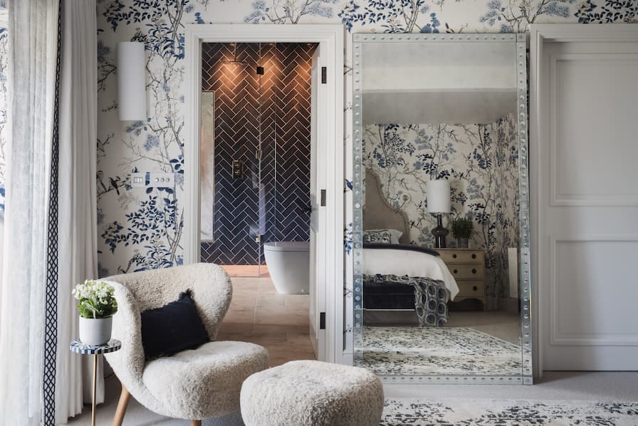 Textural Blue and White Bedroom with Sheepskin Chair and Leaning Mirror