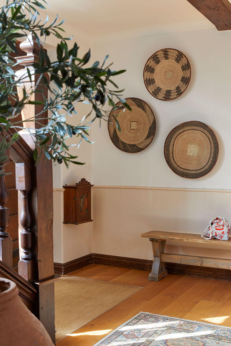 Hallway with ethnic baskets on wall