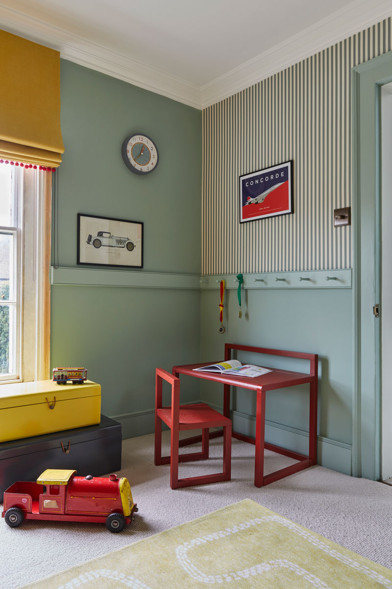 Boy's Bedroom with red desk and striped wallpaper