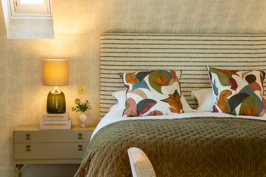 Striped headboard with colourful scatter cushions 