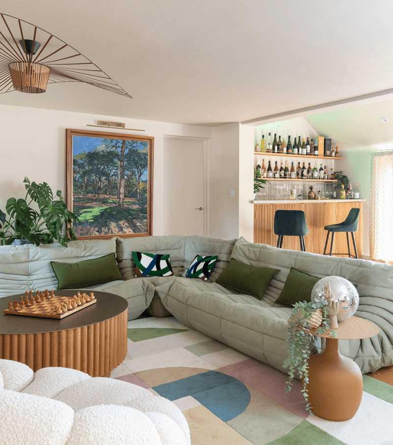 Living Room with Togo sofa bespoke rug and pendant