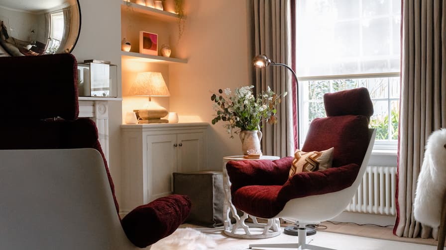 Statement red lounge chair in window