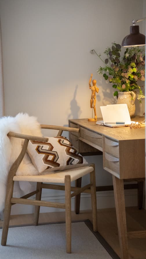 Wooden mid-century desk with sheepskin desk chair