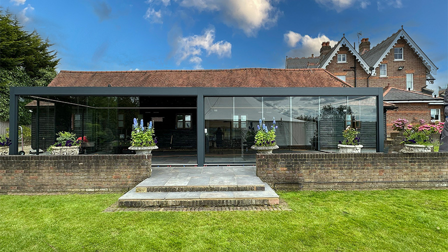 Anthracite double Louvre Pod with sliding glass doors and drop down screens