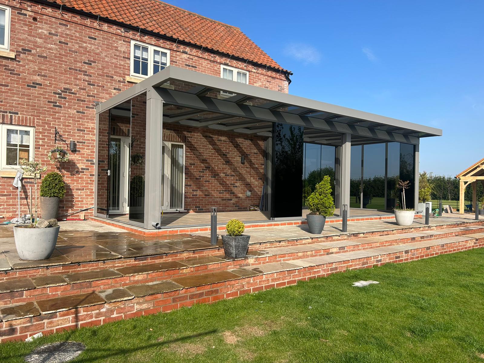 Mid-grey glass room with grey anti sun glass for sliding doors 