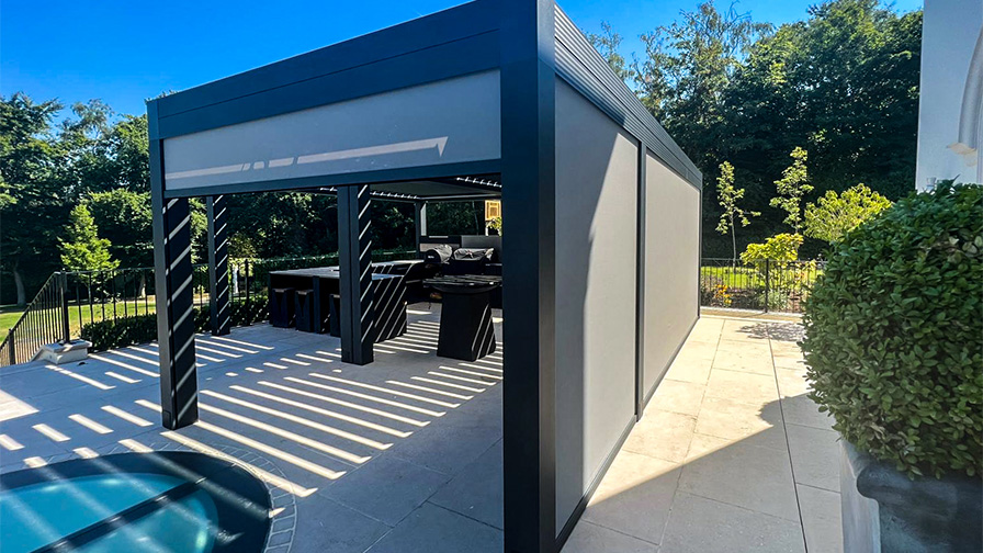 Double Louvre Pod pergola in grey with an outdoor kitchen installed