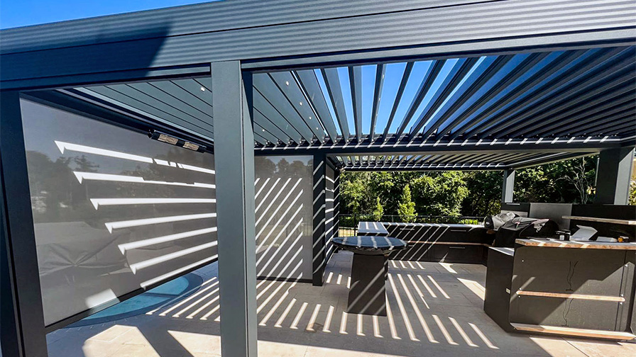 Double Louvre Pod pergola in grey with an outdoor kitchen installed