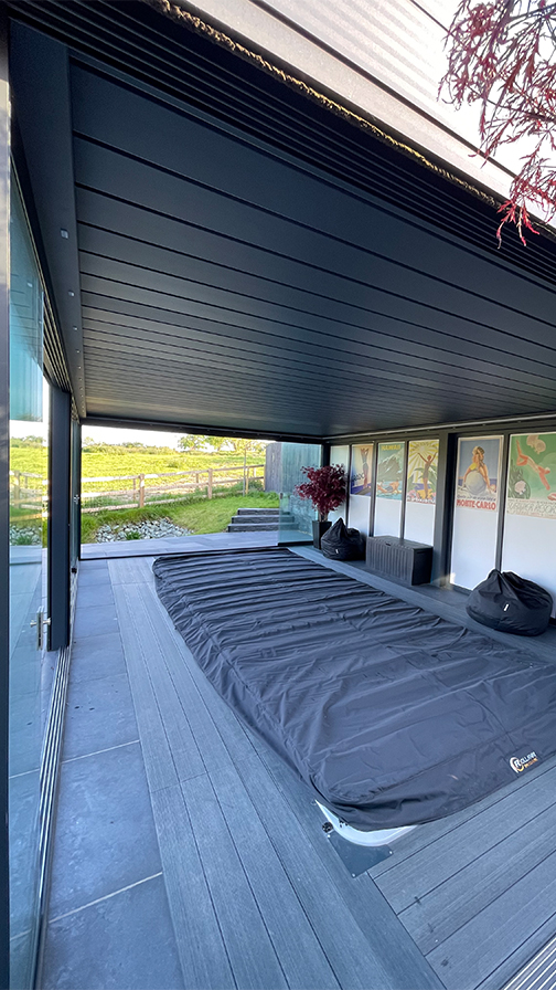 Louvred Roof pergola with glass sliding doors over a swim spa