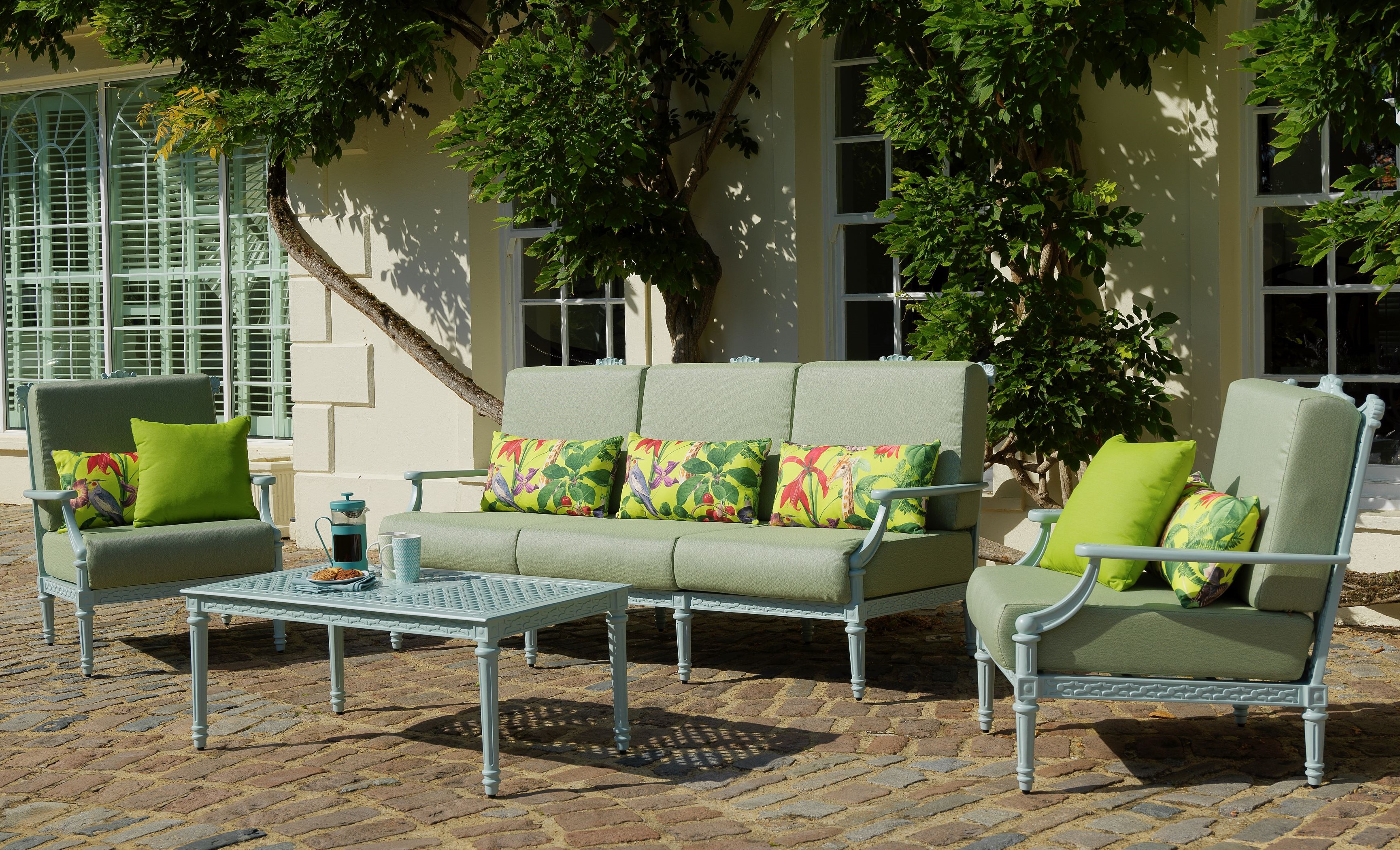 Oxley's Grande triple sofa, lounge chairs, and coffee table in Mint Blue