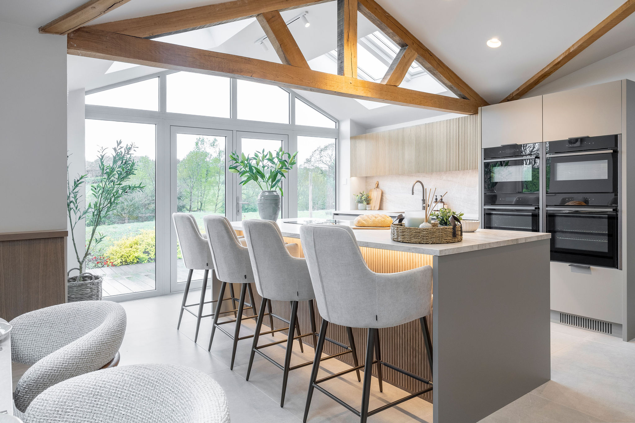 Beautifully renovated timeless kitchen with large format tiled floor and exposed oak beams