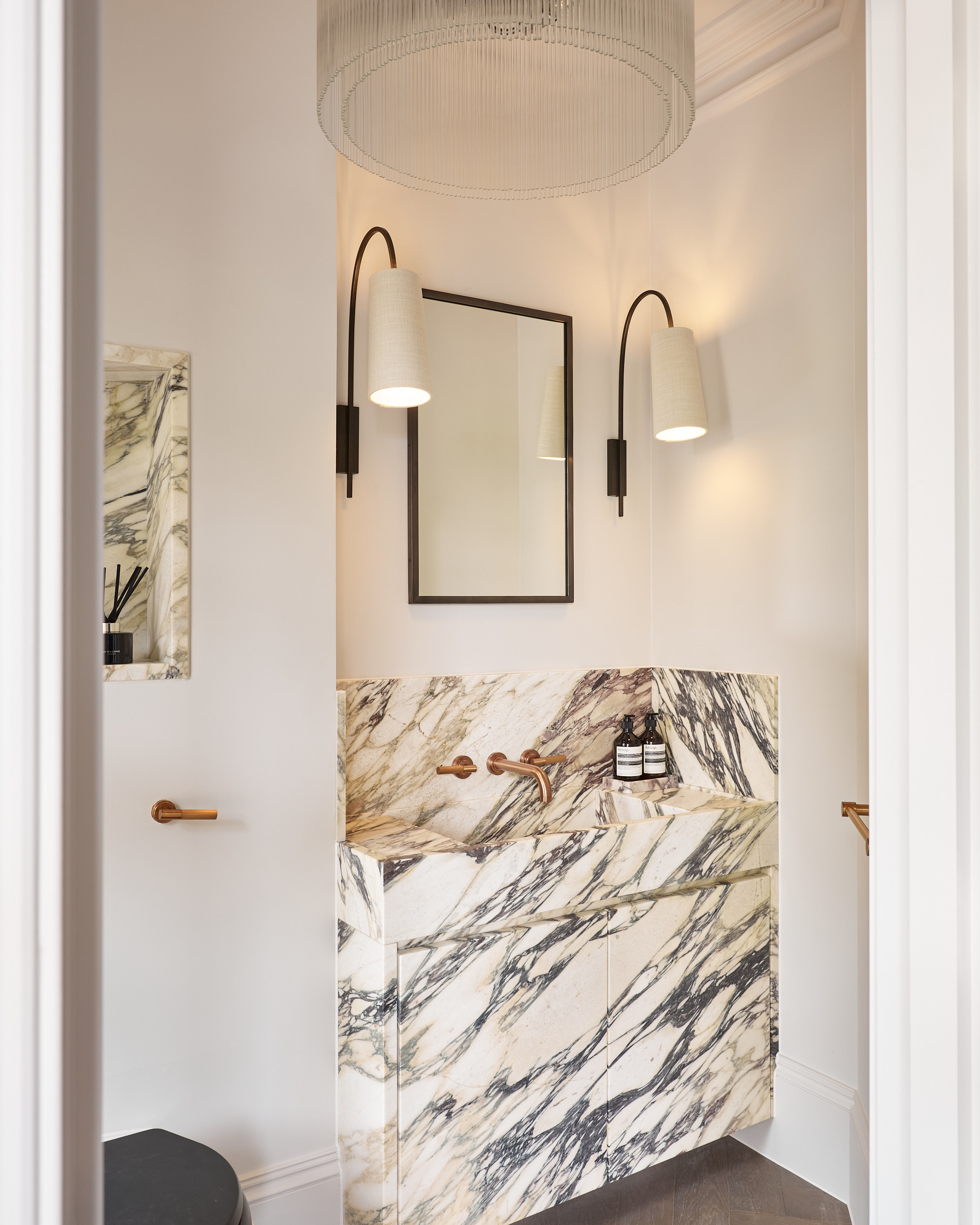 Bespoke marble vanity with Porta Romana wall lights