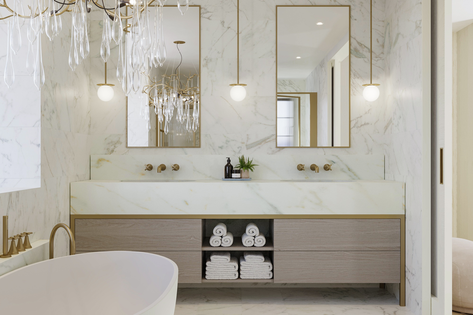 Vanity unit with marble top and wall mounted taps. Mirrors inset in the wall above, chandelier over the bath.