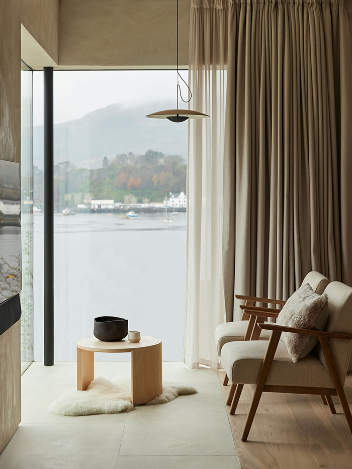 Frameless corner window overlooking the loch