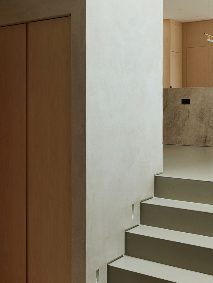 Entrance hall steps and ash joinery.