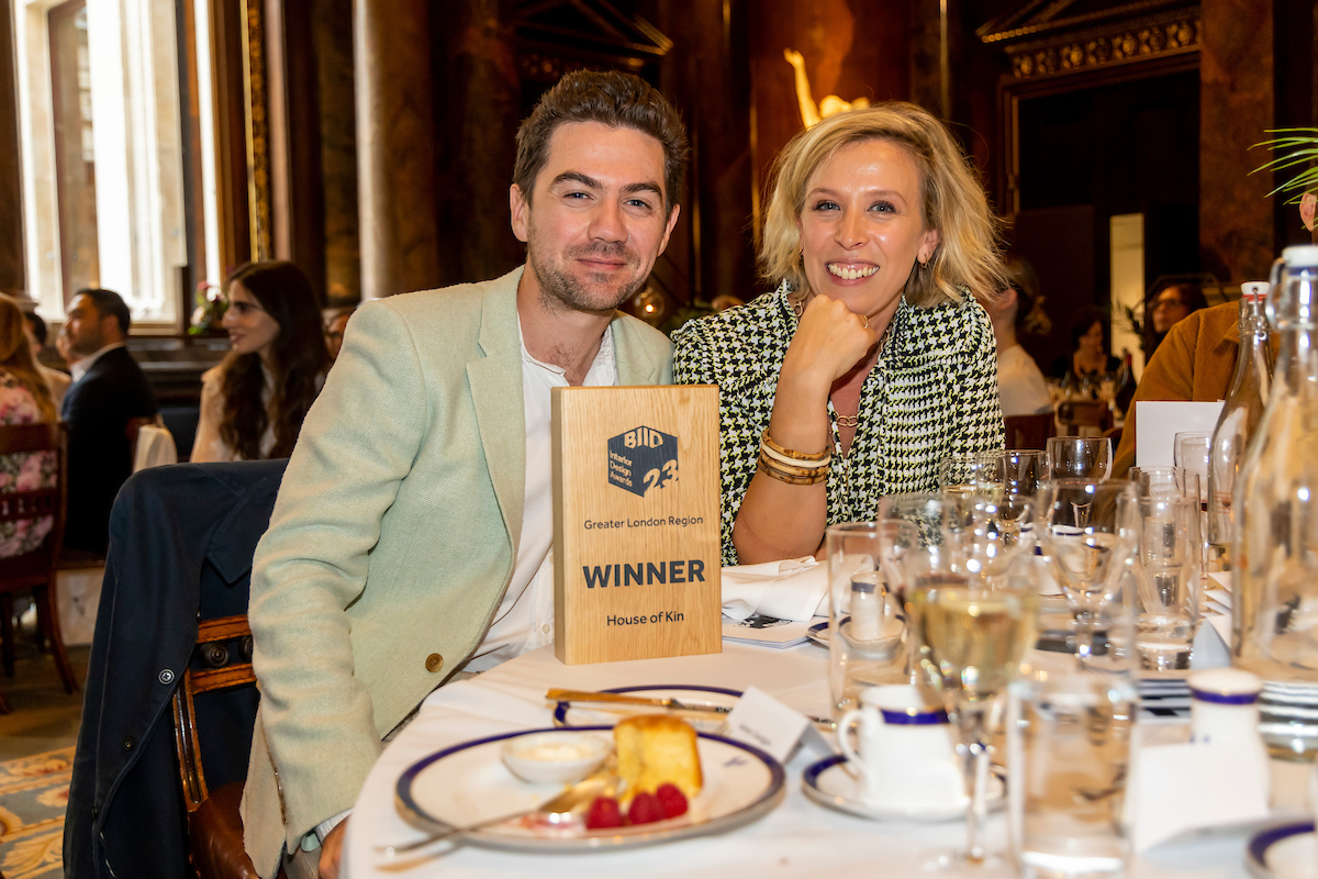 smiling winners with their award