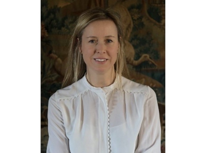 smiling blond haired woman.