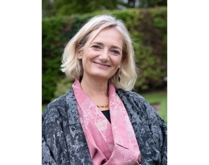 smiling blond haired woman.