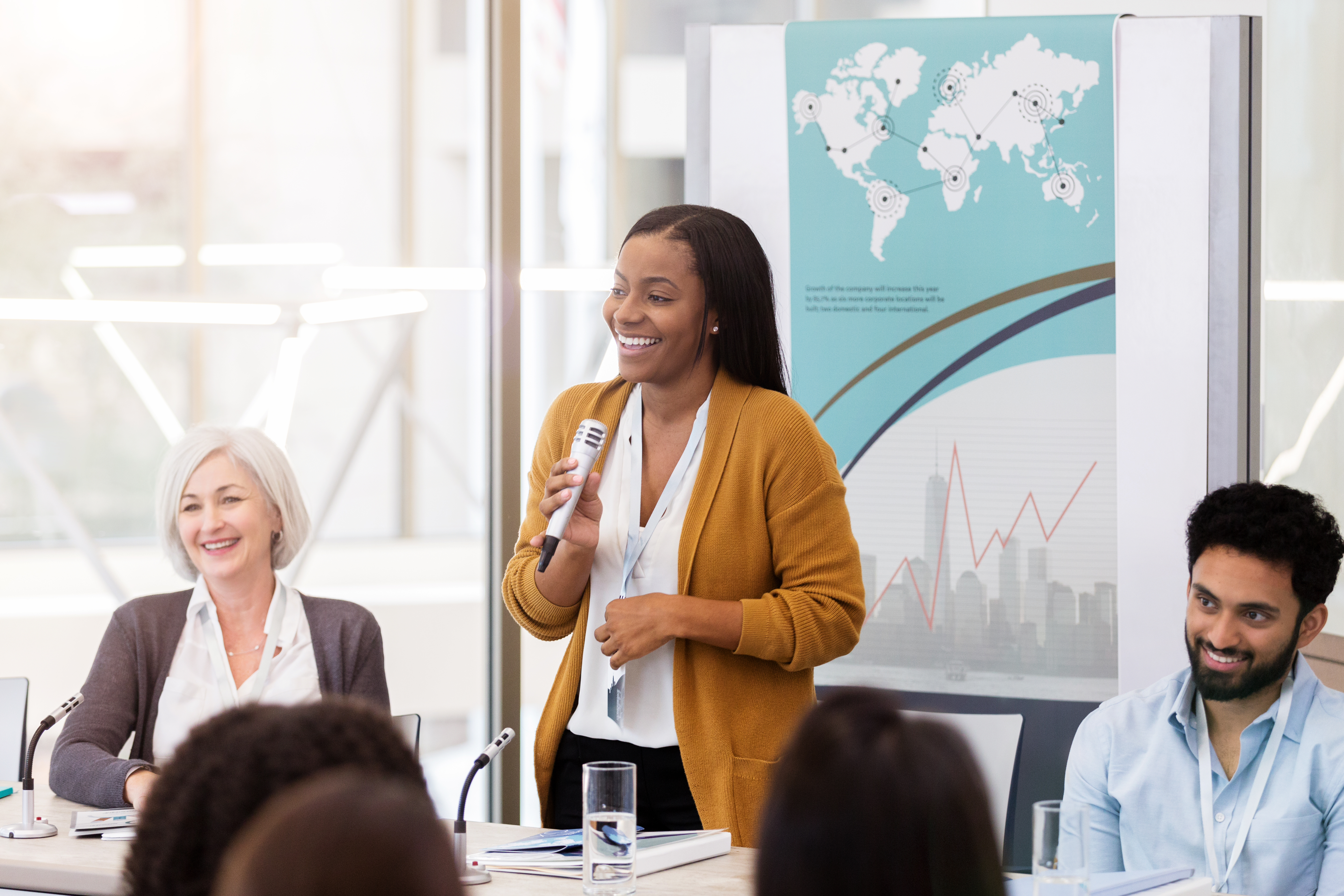 woman talking into a microphone