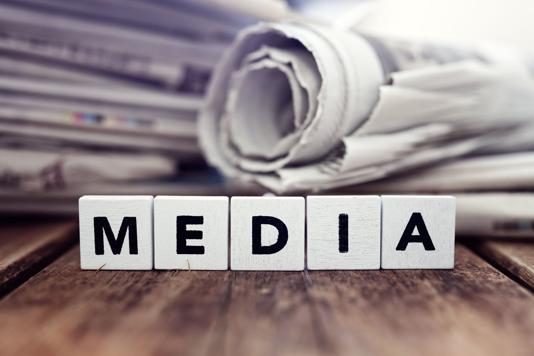 the word media in letter tiles