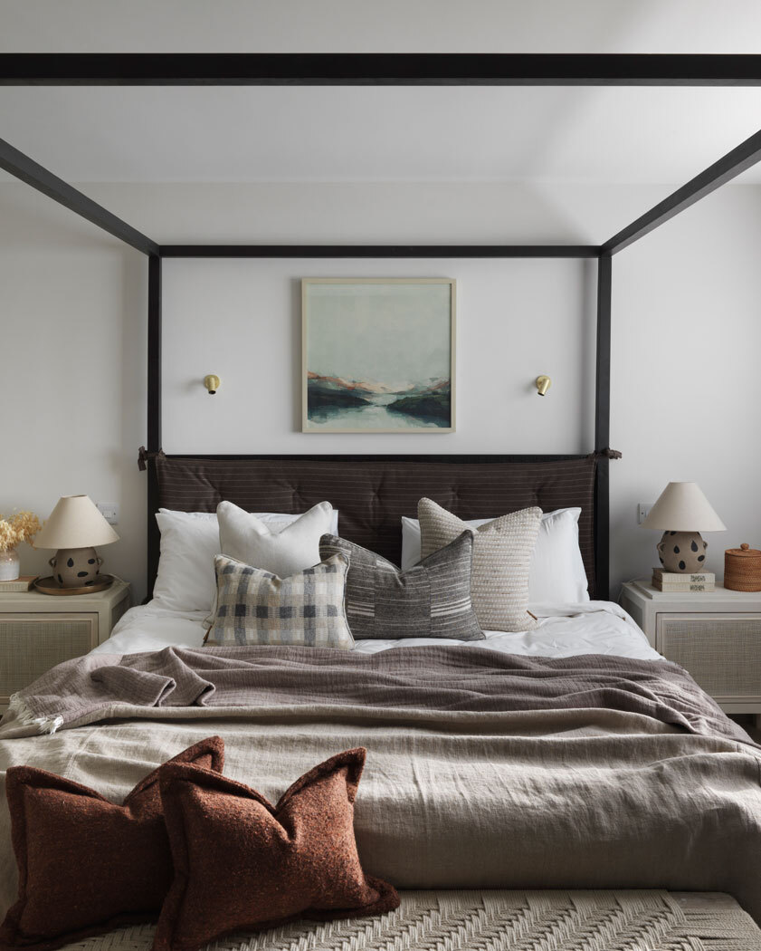 Bed with cushions and blankets