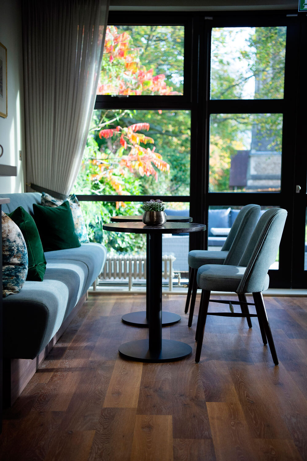 Window with dining table infront 