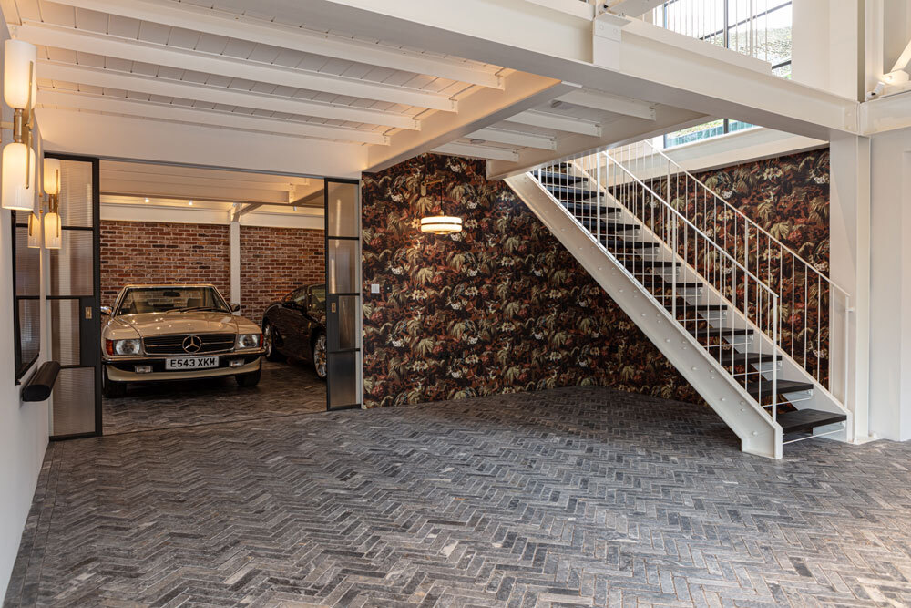 Garage with car and stairway
