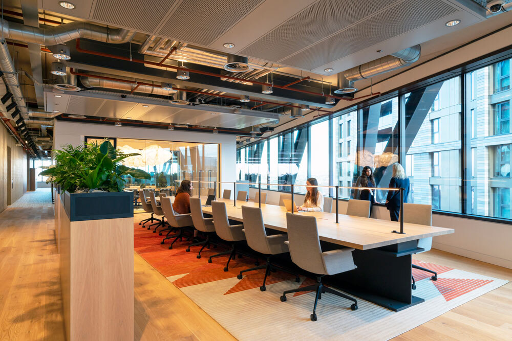 Long desk with chairs in office space