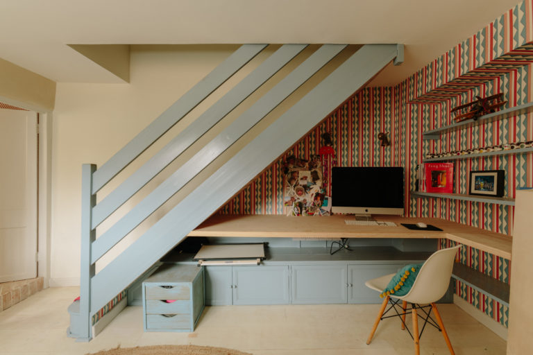 Stairs over office desk with chair
