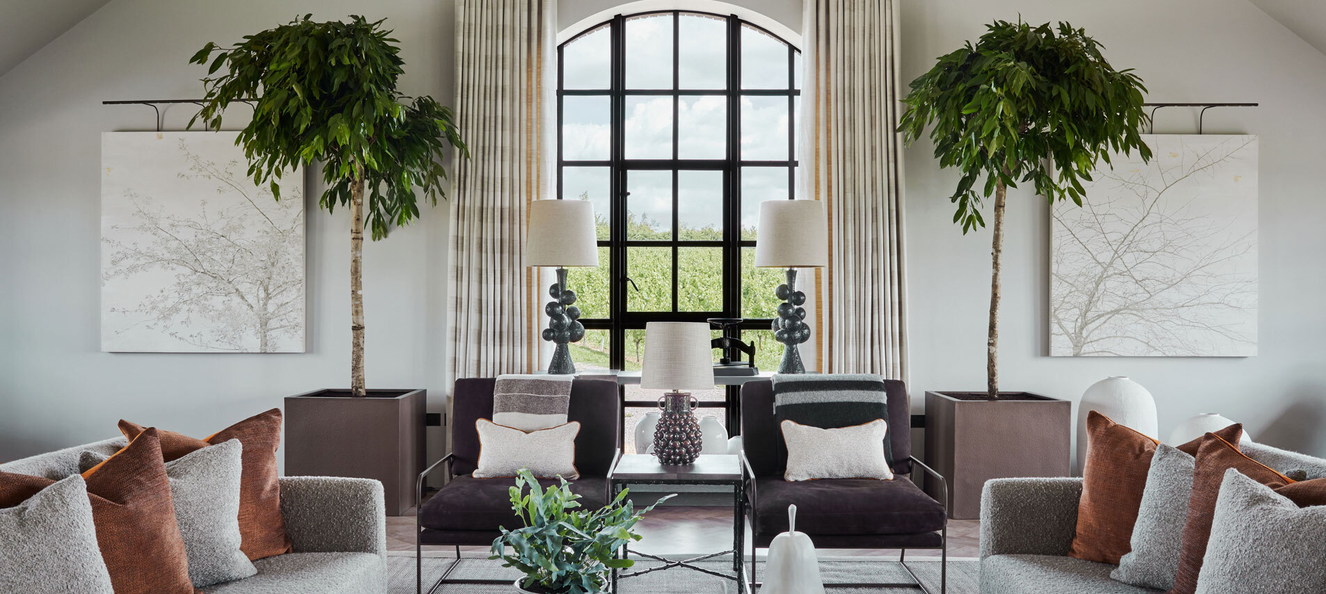 Seating area with large arched window 