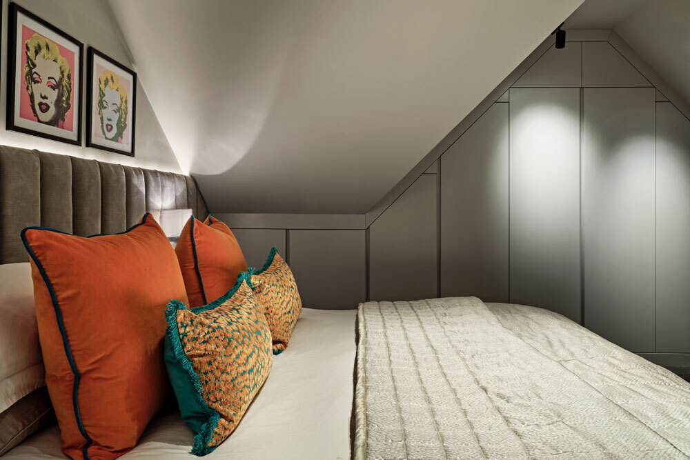 Bed with wardrobes behind