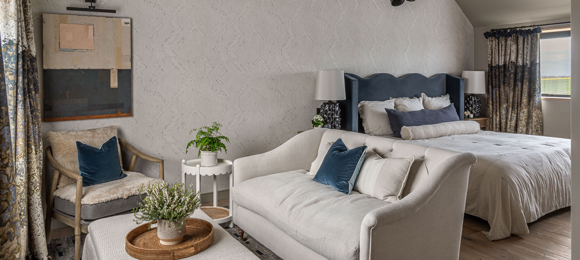 Bedroom with bed and sofa with coffee table