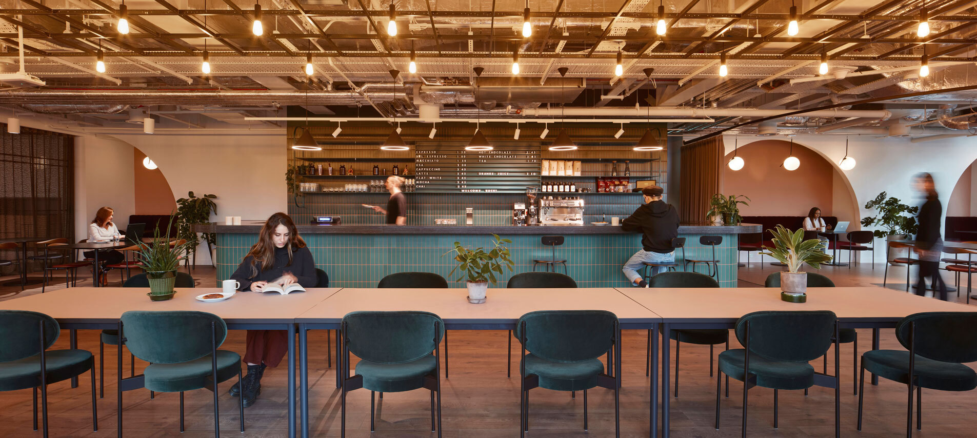 Desk area with women sat working