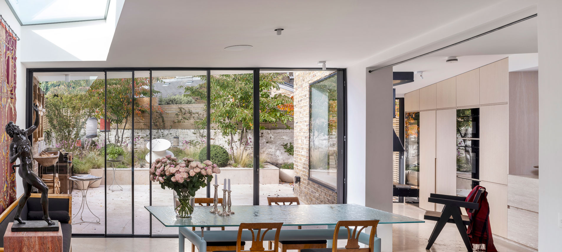kitchen with table and full length windows.