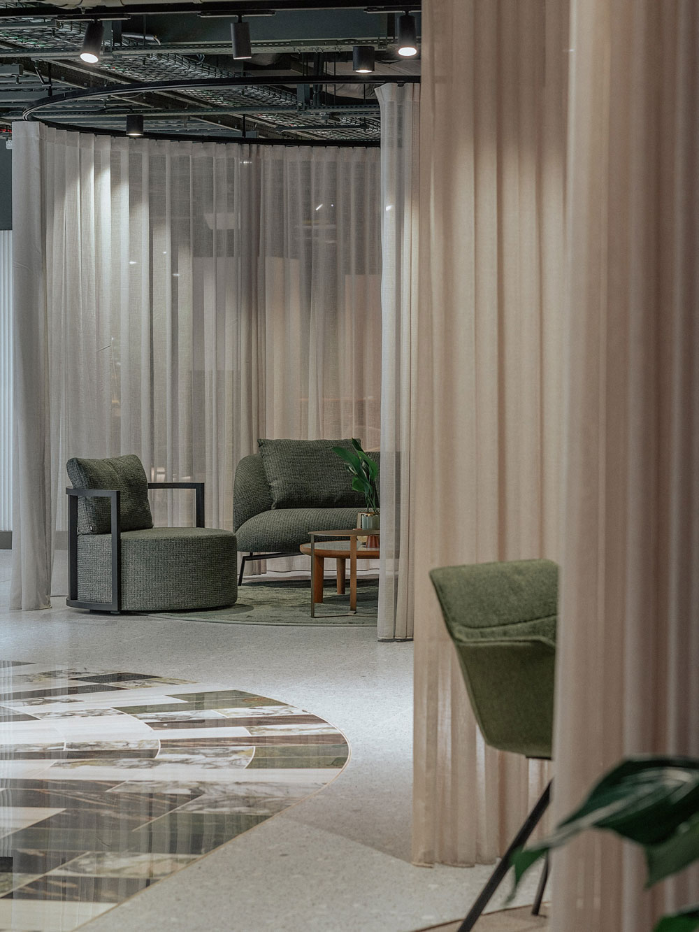 seating areas divided by curtains.