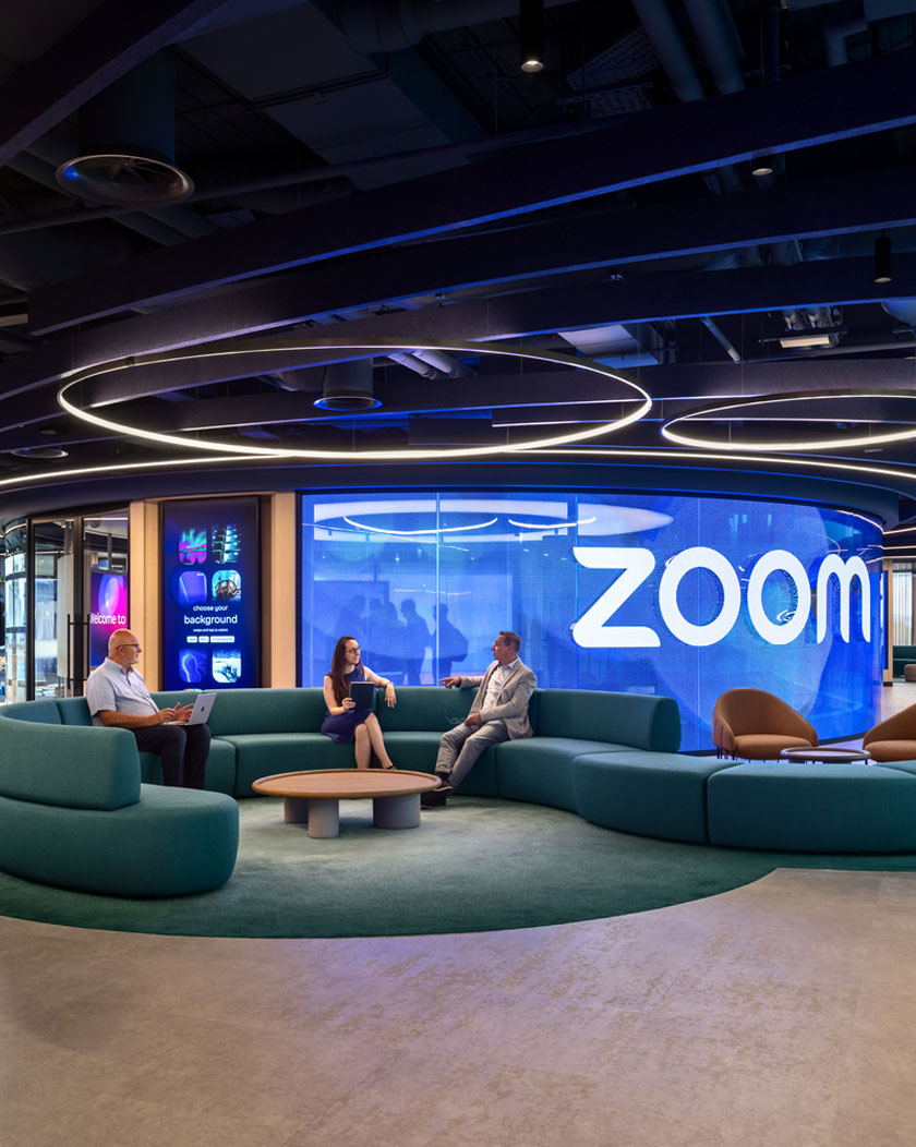 Lounge area with large screen behind.