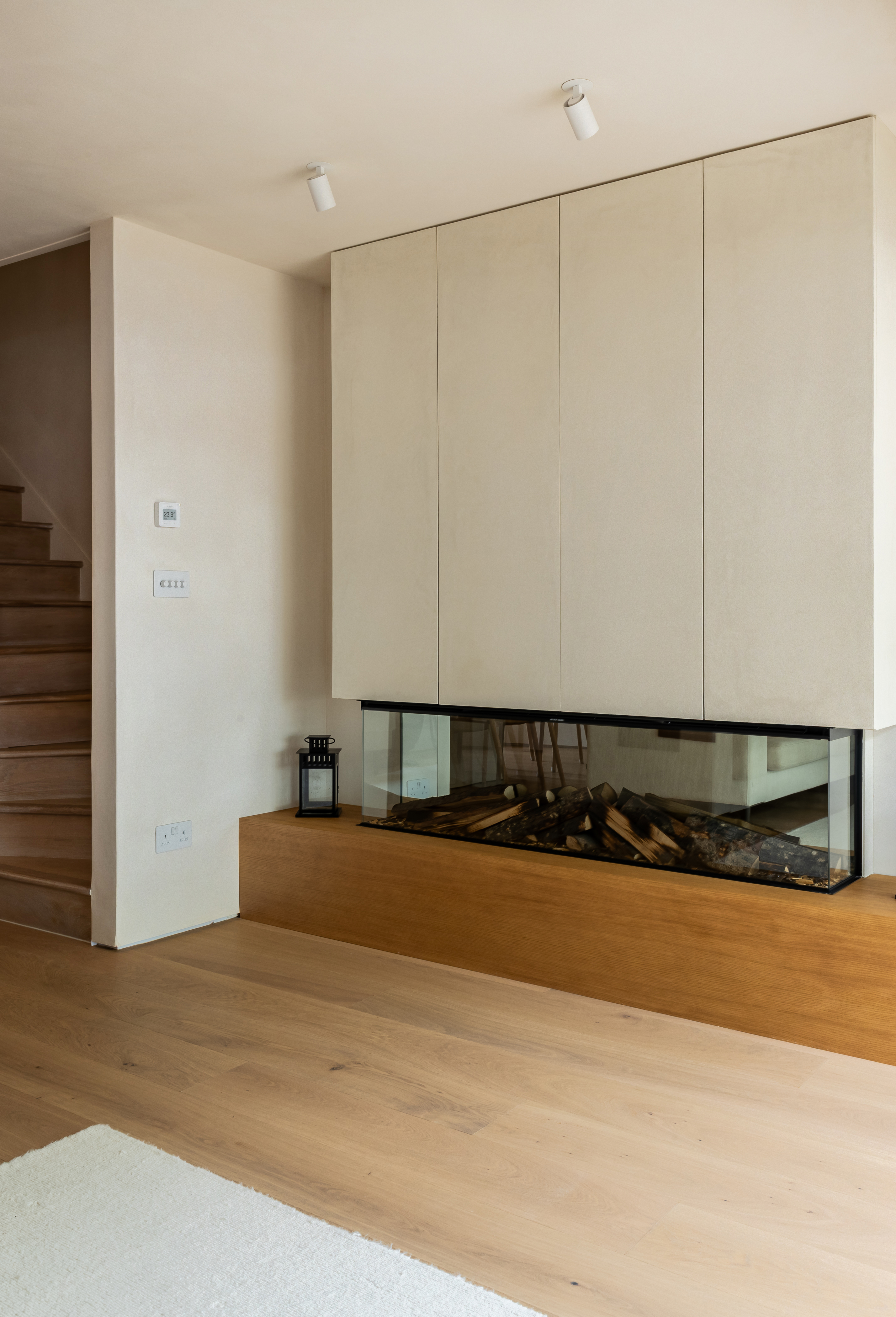 Microcrete and wood surround fireplace