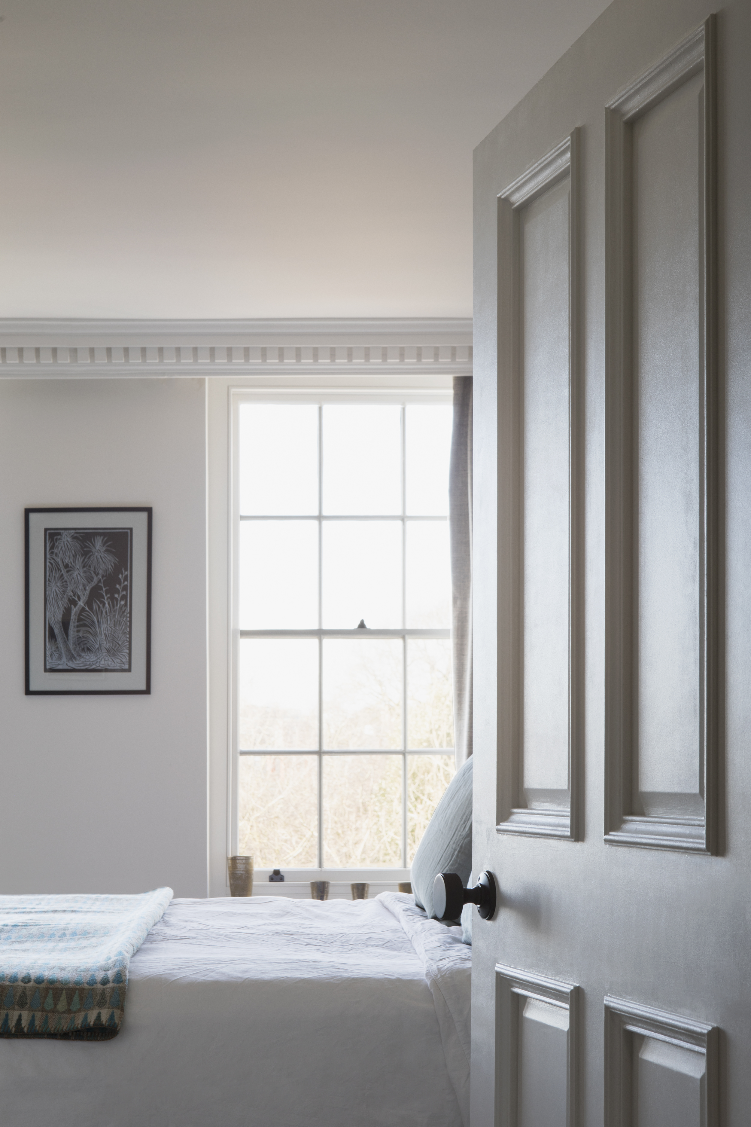 Bedroom room door with bed in background