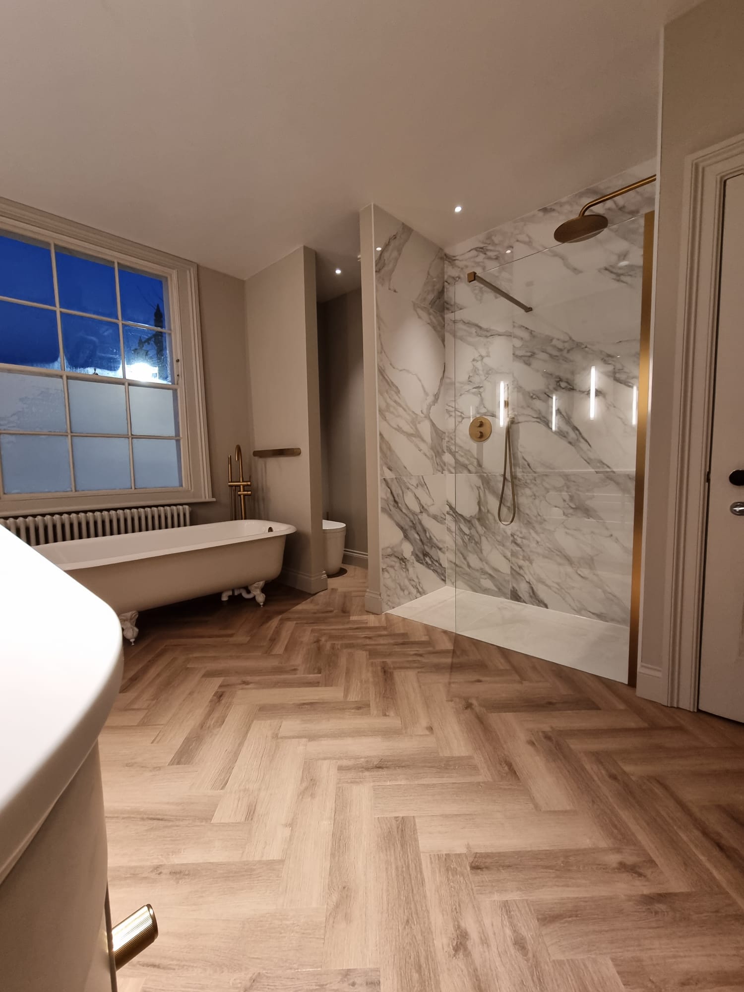 View of the bath, shower and toilet with privacy 